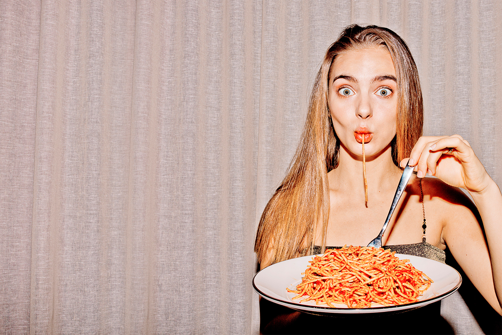 girl sucking on spaghetti